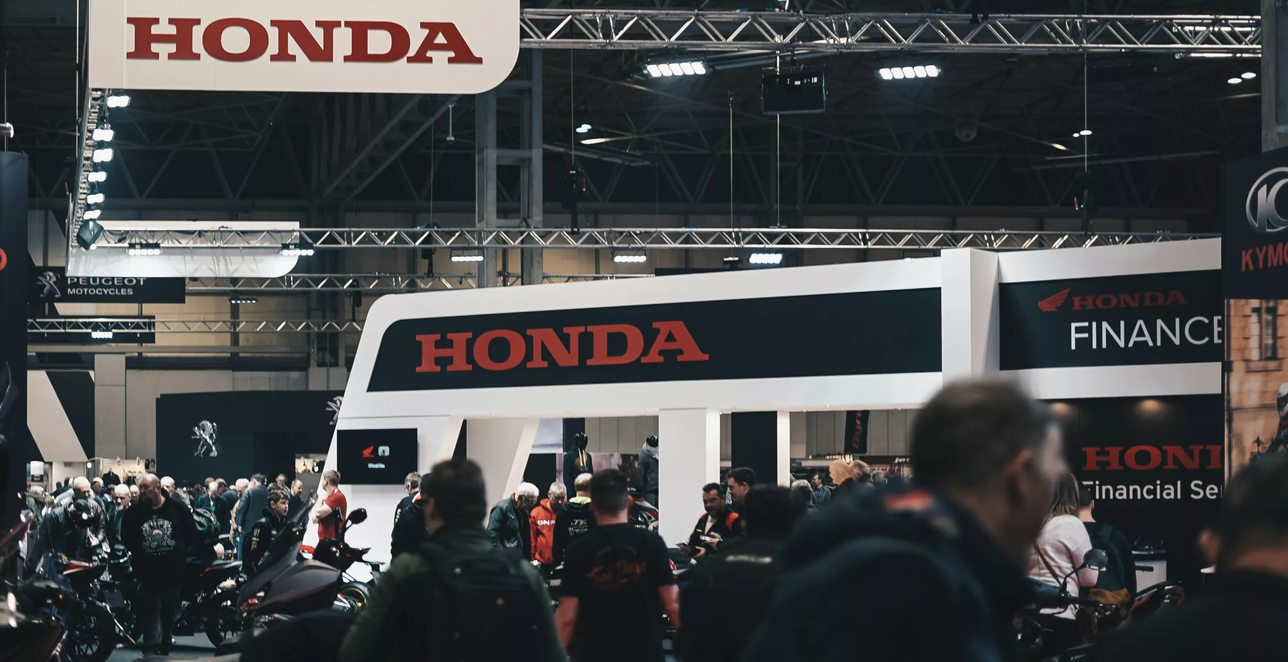 Trade Show showing a crowd at a Honda booth