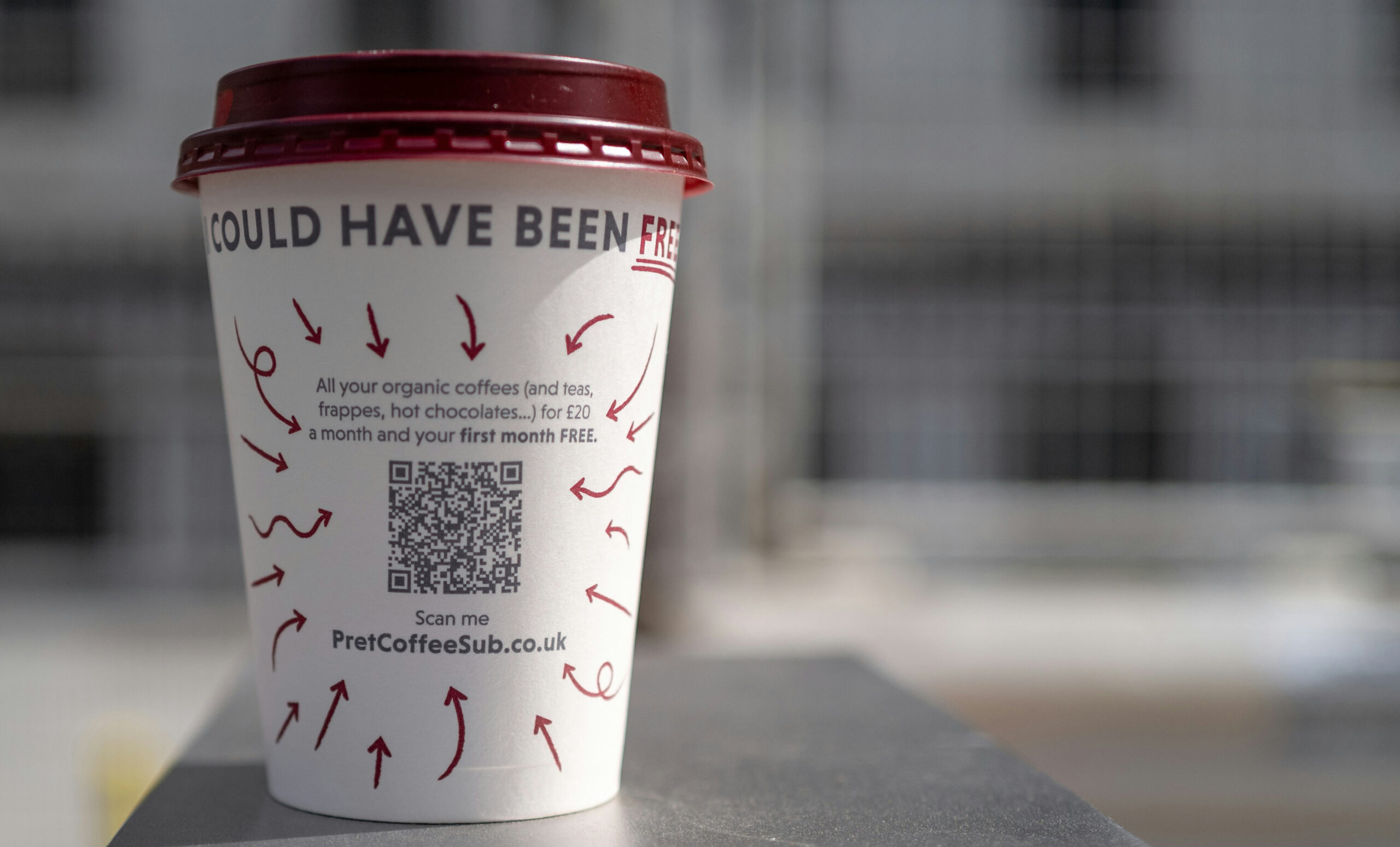 QR Code on a Coffee Cup advertising the Free Coffee Program